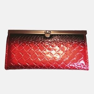 Women's wallet snakeskin embossed red and black ombre with silver lining.
